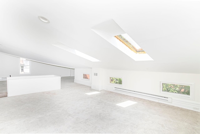 416 E 8th St, Newport, KY 41071 - bonus room with a baseboard radiator, a skylight, lofted ceiling, carpet, and healthy amount of natural light