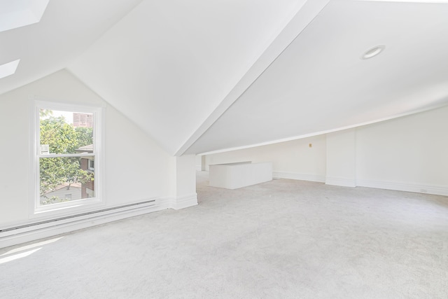416 E 8th St, Newport, KY 41071 - bonus room with a baseboard heating unit, vaulted ceiling, a skylight, and carpet flooring