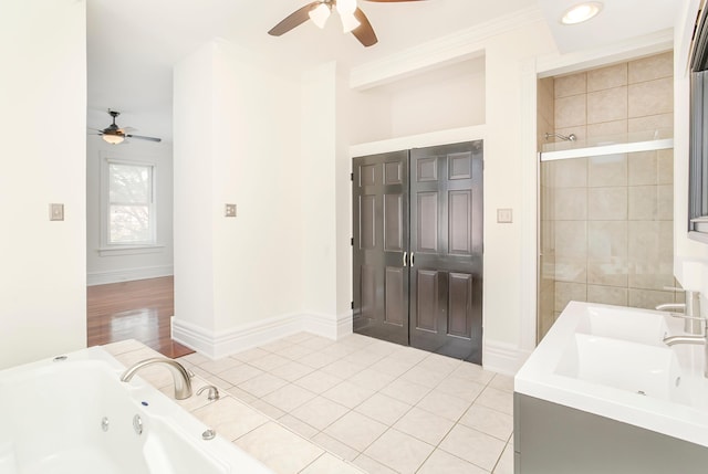 416 E 8th St, Newport, KY 41071 - bathroom with ceiling fan, a tub with jets, ornamental molding, tiled shower, and tile patterned floors