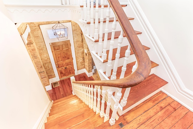 416 E 8th St, Newport, KY 41071 - stairway featuring a chandelier and wood-type flooring
