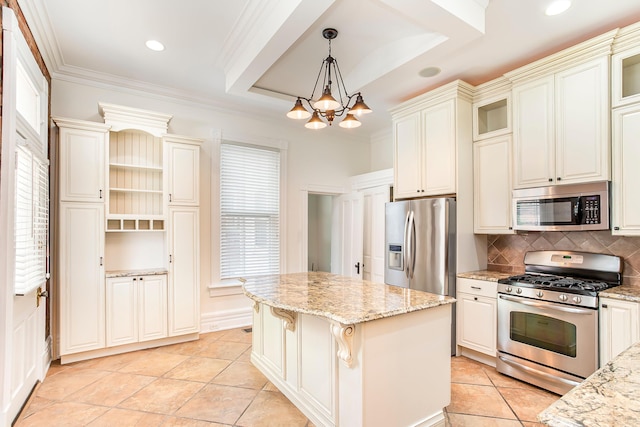 416 E 8th St, Newport, KY 41071 - kitchen featuring stainless steel appliances, a chandelier, tasteful backsplash, light stone countertops, and pendant lighting