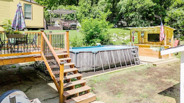 15 21st St, Newport, KY 41071 - view of yard featuring a wooden deck, a pergola, an outdoor pool, stairway, and view of scattered trees
