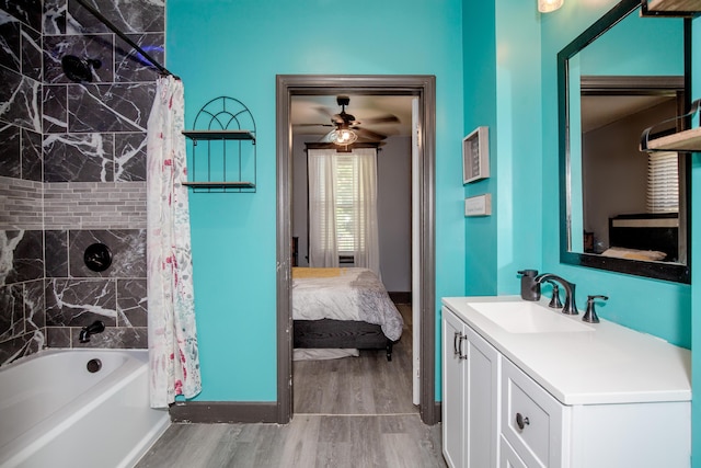 15 21st St, Newport, KY 41071 - bathroom featuring ensuite bathroom, vanity, wood finished floors, shower / tub combo with curtain, and a ceiling fan