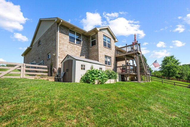 10302 Limerick Cir, Covington, KY 41015 - rear view of house with a storage shed, a wooden deck, and brick siding