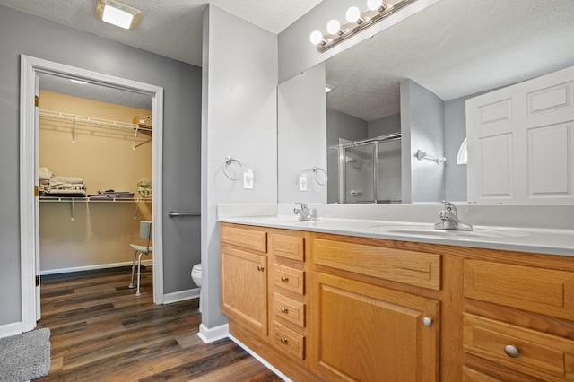 10302 Limerick Cir, Covington, KY 41015 - full bath featuring a shower stall, double vanity, wood finished floors, and a walk in closet