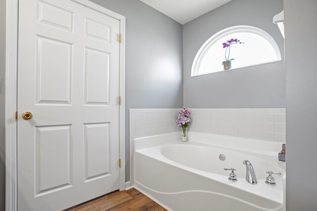 10302 Limerick Cir, Covington, KY 41015 - full bathroom featuring a garden tub and wood finished floors