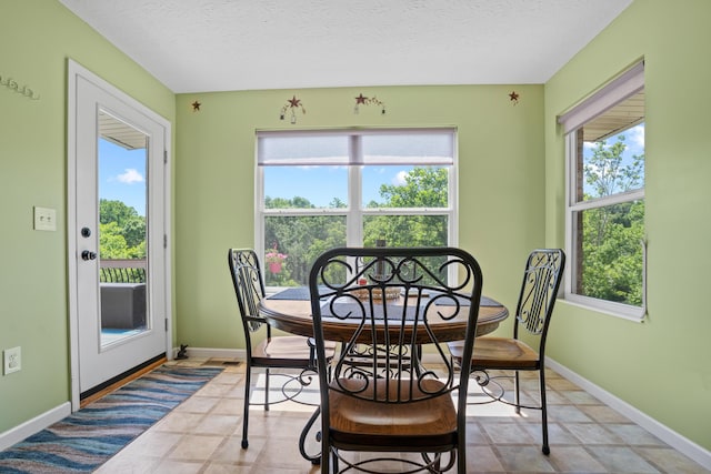 10302 Limerick Cir, Covington, KY 41015 - dining area with healthy amount of natural light and a textured ceiling