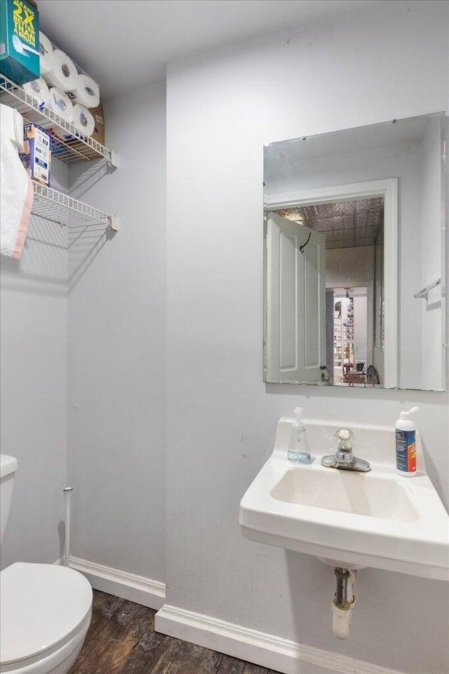 411 E 10th St, Newport, KY 41071 - bathroom with toilet and wood finished floors