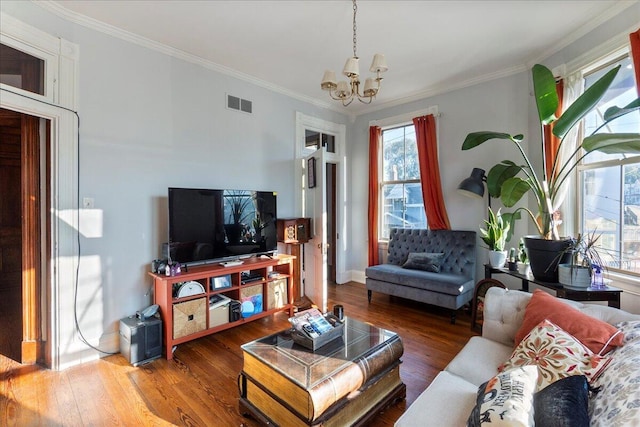 411 E 10th St, Newport, KY 41071 - living area with a chandelier, ornamental molding, and wood finished floors