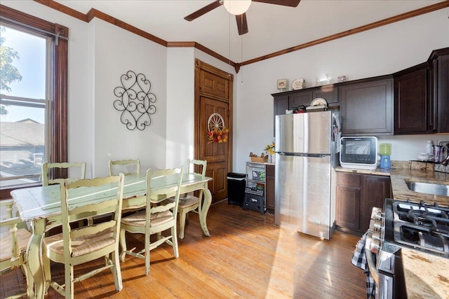 411 E 10th St, Newport, KY 41071 - dining space featuring a ceiling fan, ornamental molding, and light wood finished floors