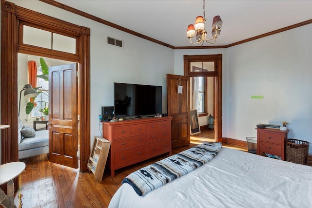 411 E 10th St, Newport, KY 41071 - bedroom with hardwood / wood-style flooring, ornamental molding, and a chandelier