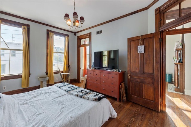 411 E 10th St, Newport, KY 41071 - bedroom featuring dark wood-style flooring, a chandelier, multiple windows, and crown molding