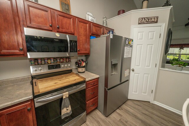 1155 Breckenridge Ln, Hebron, KY 41048 - kitchen featuring appliances with stainless steel finishes, light wood-style flooring, and light countertops