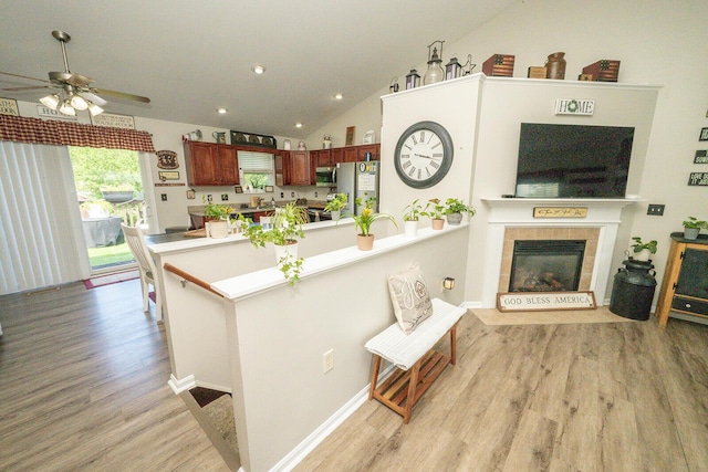 1155 Breckenridge Ln, Hebron, KY 41048 - kitchen featuring stainless steel appliances, light wood-type flooring, lofted ceiling, a peninsula, and a ceiling fan