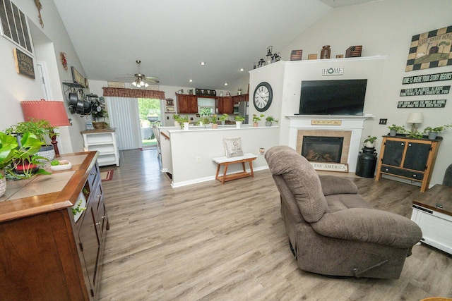 1155 Breckenridge Ln, Hebron, KY 41048 - living room featuring lofted ceiling, a ceiling fan, light wood finished floors, a tiled fireplace, and recessed lighting