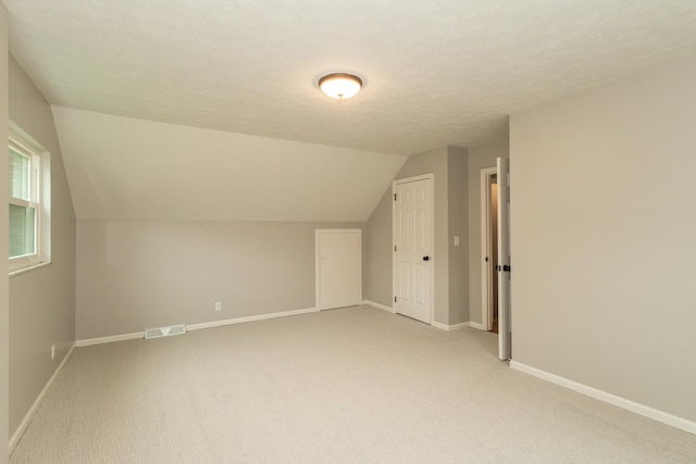 94 Mayo Cir, Newport, KY 41071 - additional living space featuring vaulted ceiling and light colored carpet