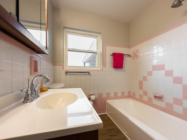 94 Mayo Cir, Newport, KY 41071 - bathroom featuring tile walls, a tub, wood finished floors, and vanity