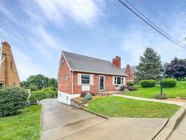 94 Mayo Cir, Newport, KY 41071 - view of front of home featuring driveway, brick siding, a front yard, a chimney, and roof with shingles