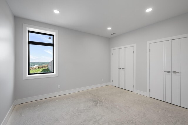 5090 Bella Vista Dr, Cold Spring, KY 41076 - unfurnished bedroom featuring two closets, recessed lighting, and concrete floors