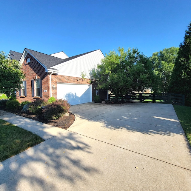 4467 Hackberry Ct, Burlington, KY 41005 - view of home's exterior featuring brick siding, driveway, and an attached garage
