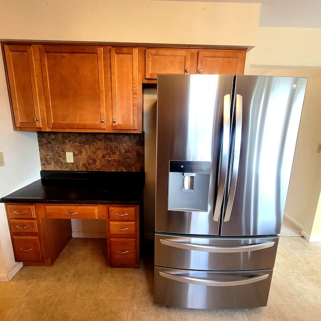 4467 Hackberry Ct, Burlington, KY 41005 - kitchen with stainless steel fridge with ice dispenser, brown cabinetry, decorative backsplash, and dark countertops