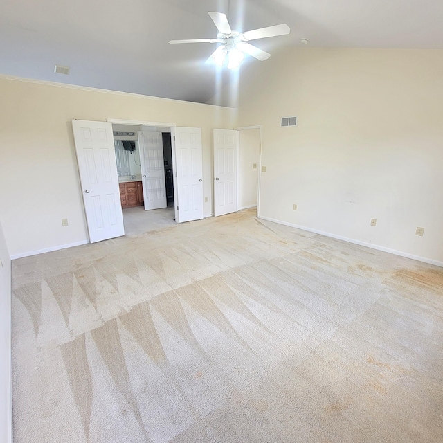 4467 Hackberry Ct, Burlington, KY 41005 - unfurnished bedroom featuring light carpet, vaulted ceiling, connected bathroom, and ceiling fan