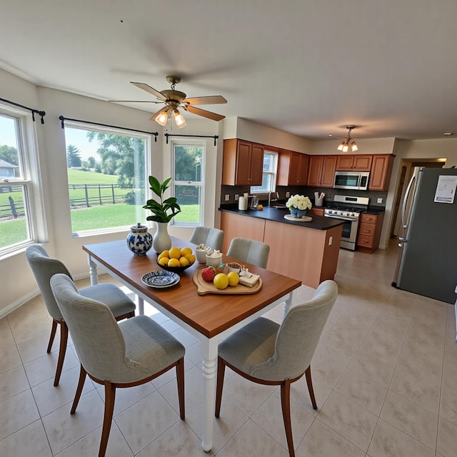 4467 Hackberry Ct, Burlington, KY 41005 - dining room featuring plenty of natural light, light tile patterned flooring, and a ceiling fan
