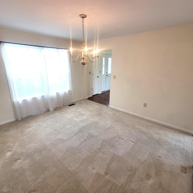 4467 Hackberry Ct, Burlington, KY 41005 - carpeted spare room featuring a chandelier and baseboards