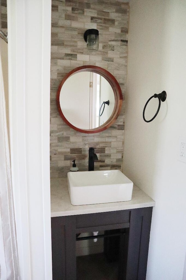713 Ferncliffe Ave, Crescent Springs, KY 41017 - bathroom with vanity, tile walls, and tasteful backsplash