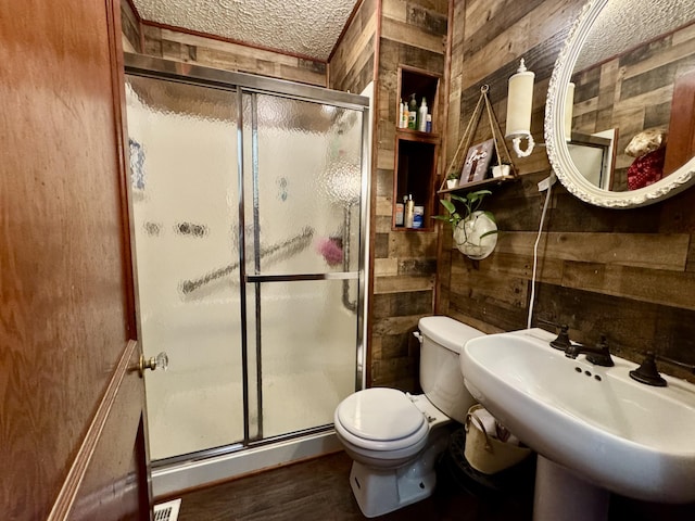 12155 Riggs Rd, Independence, KY 41051 - full bath featuring wood walls, a shower stall, a textured ceiling, and wood finished floors