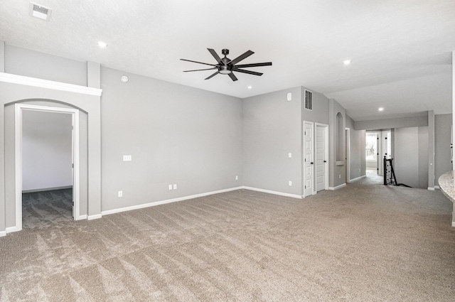 2175 Piazza Rdg, Covington, KY 41017 - unfurnished living room with a ceiling fan, carpet floors, arched walkways, recessed lighting, and vaulted ceiling