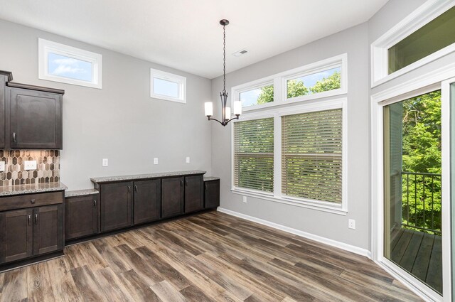 2175 Piazza Rdg, Covington, KY 41017 - unfurnished dining area featuring dark wood-type flooring and a chandelier