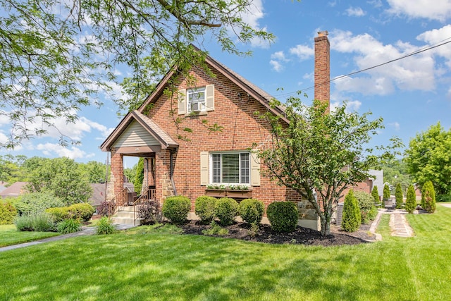 65 W Crittenden Ave, Fort Wright, KY 41011 - view of front facade with a front lawn, brick siding, and a chimney