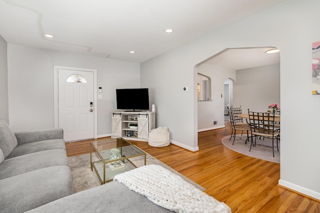 65 W Crittenden Ave, Fort Wright, KY 41011 - living room featuring arched walkways, wood finished floors, and recessed lighting