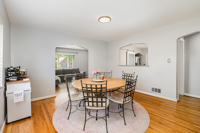 65 W Crittenden Ave, Fort Wright, KY 41011 - dining room with arched walkways and light wood-type flooring