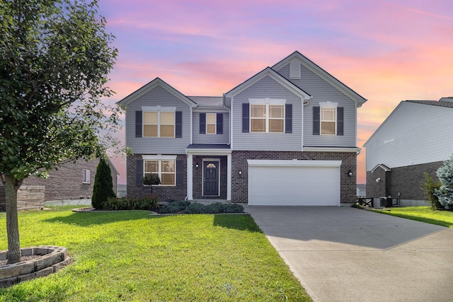 1353 Dominion Trl, Hebron, KY 41048 - traditional-style home with brick siding, concrete driveway, an attached garage, and a yard