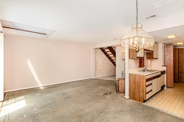 2646 Bryan Station Ln, Crestview Hills, KY 41017 - kitchen with concrete floors, light countertops, pendant lighting, and a chandelier