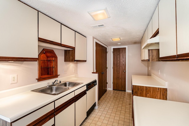 2646 Bryan Station Ln, Crestview Hills, KY 41017 - kitchen featuring dishwashing machine, a textured ceiling, light countertops, and white cabinets