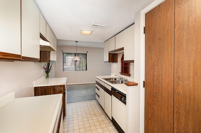 2646 Bryan Station Ln, Crestview Hills, KY 41017 - kitchen featuring dishwasher, light countertops, white cabinets, decorative light fixtures, and a textured ceiling