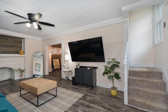 21141/2 Glenway Ave, Covington, KY 41014 - living area with wood finished floors, stairs, ceiling fan, and a brick fireplace