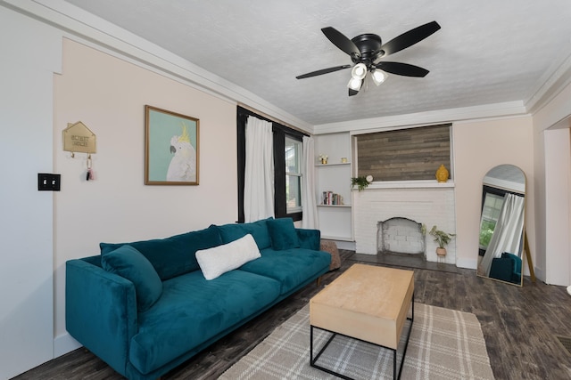21141/2 Glenway Ave, Covington, KY 41014 - living room featuring a ceiling fan, a brick fireplace, wood finished floors, crown molding, and a textured ceiling