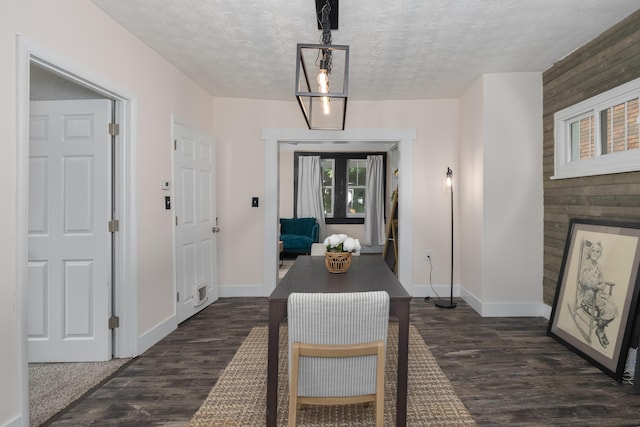 21141/2 Glenway Ave, Covington, KY 41014 - dining area with dark wood-type flooring, a textured ceiling, and wooden walls