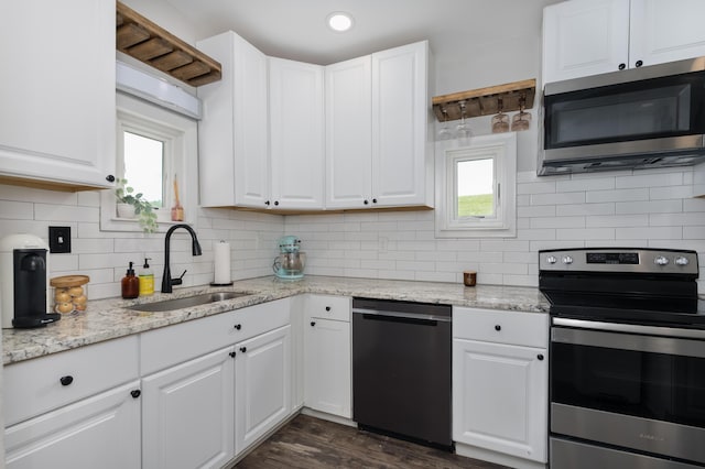 21141/2 Glenway Ave, Covington, KY 41014 - kitchen with stainless steel appliances, tasteful backsplash, white cabinetry, light stone countertops, and recessed lighting