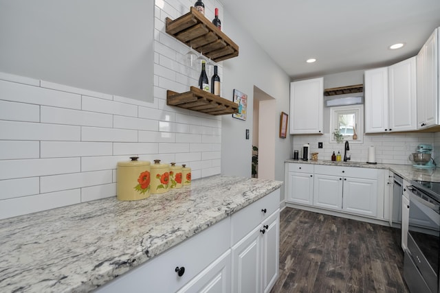 21141/2 Glenway Ave, Covington, KY 41014 - kitchen featuring tasteful backsplash, white cabinetry, dark wood-type flooring, light stone countertops, and recessed lighting