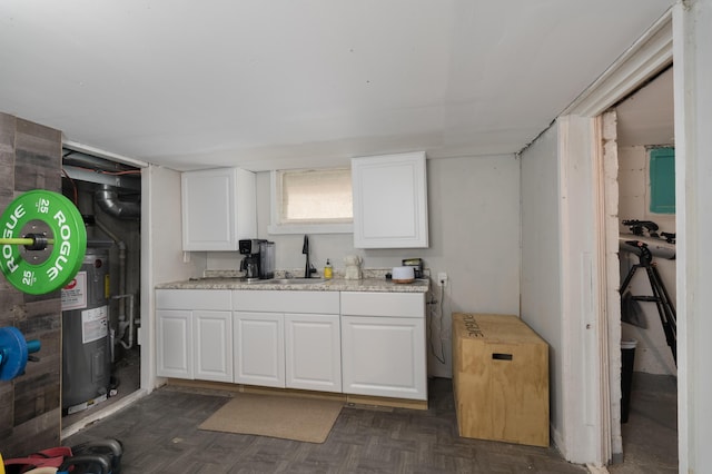 21141/2 Glenway Ave, Covington, KY 41014 - kitchen with white cabinets, light countertops, and electric water heater