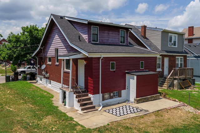21141/2 Glenway Ave, Covington, KY 41014 - back of property featuring a yard, a shingled roof, a chimney, stairway, and a patio area