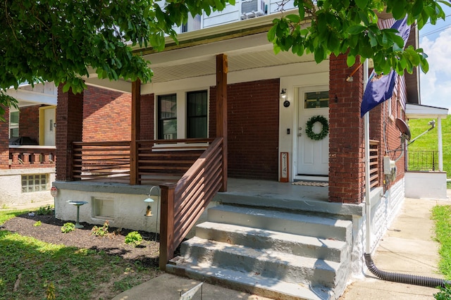 21141/2 Glenway Ave, Covington, KY 41014 - doorway to property featuring brick siding and a porch