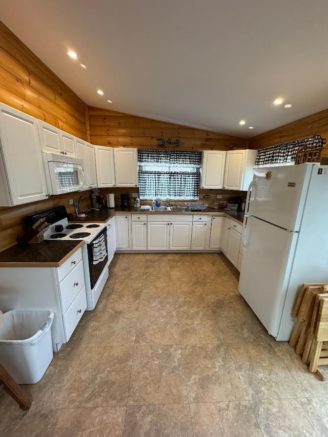 445 Davis Lake Rd # 1, Owenton, KY 40359 - kitchen featuring white appliances, lofted ceiling, dark countertops, white cabinetry, and recessed lighting