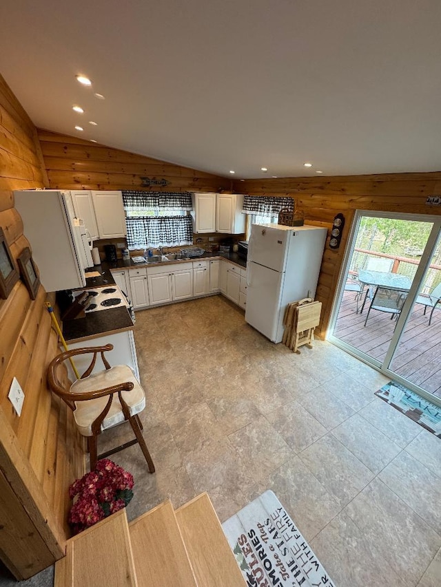 445 Davis Lake Rd # 1, Owenton, KY 40359 - kitchen with freestanding refrigerator, dark countertops, vaulted ceiling, white cabinetry, and recessed lighting