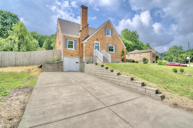 797 Highland Ave, Fort Wright, KY 41011 - tudor home featuring brick siding, a chimney, and a shingled roof